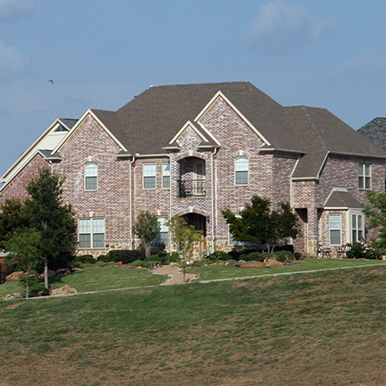 Exterior of brick home in Benbrook by Platinum Painting