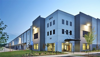 a modern warehouse building in the evening