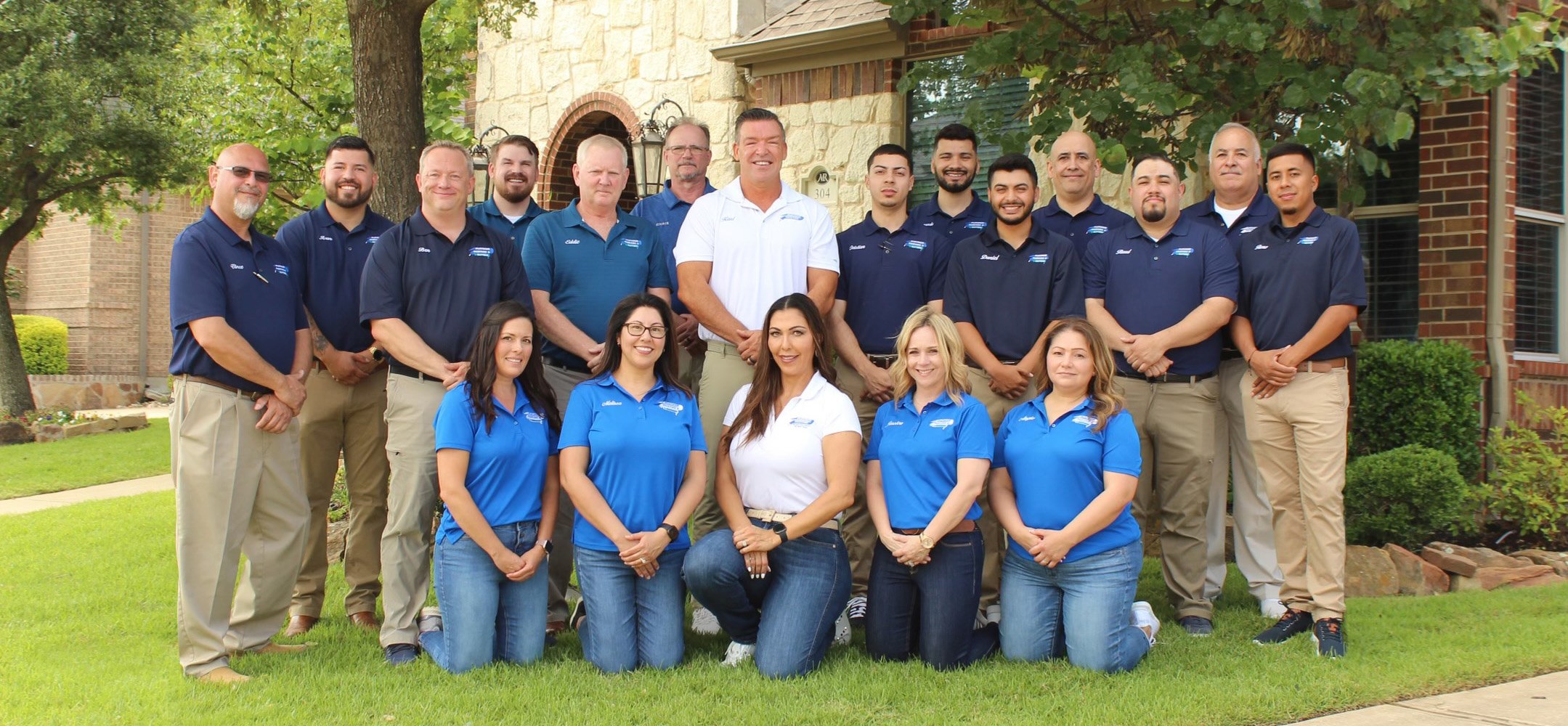 Platinum Painting of Fort Worth team members smiling outdoors
