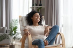 person sitting in a chair and relaxing in a room