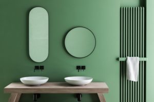 a clean bathroom with green walls