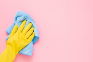 glove and hand to safely clean the walls