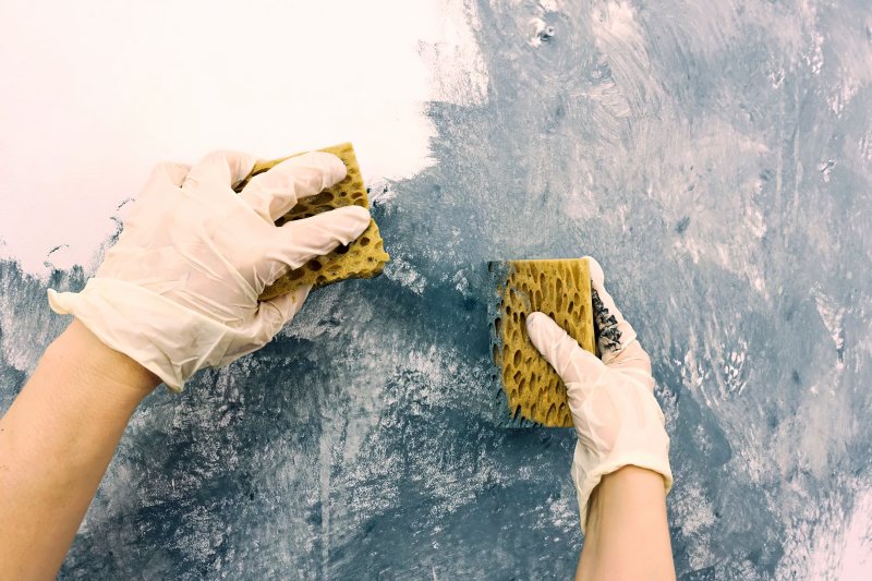closeup of person creating a sponge wall 