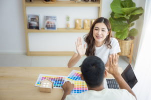 a couple selecting a shade of interior paint