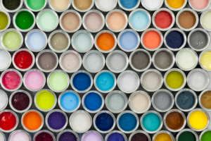 an assortment of colored paint cans