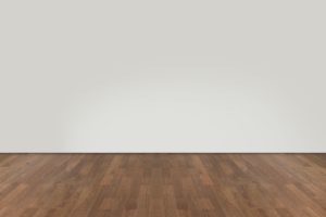 hardwood floor with a white wall background