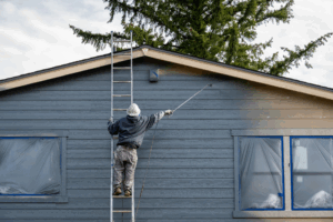 a homeowner painting their house
